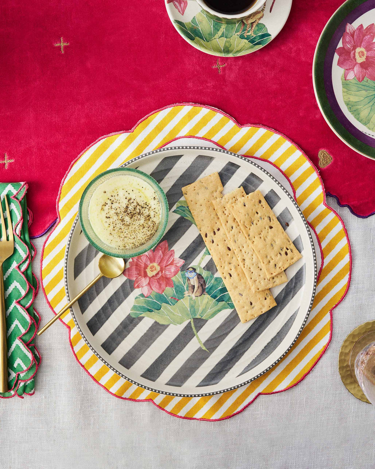 Lily Pond platter serving dip and crackers with a gold spoon.
