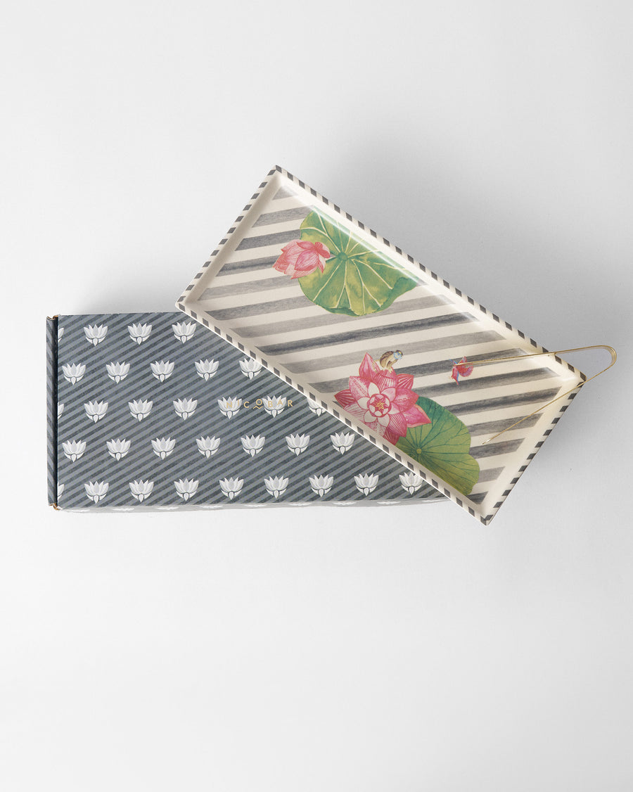 The Lotus Garden tray resting on its black and white patterned gift box
