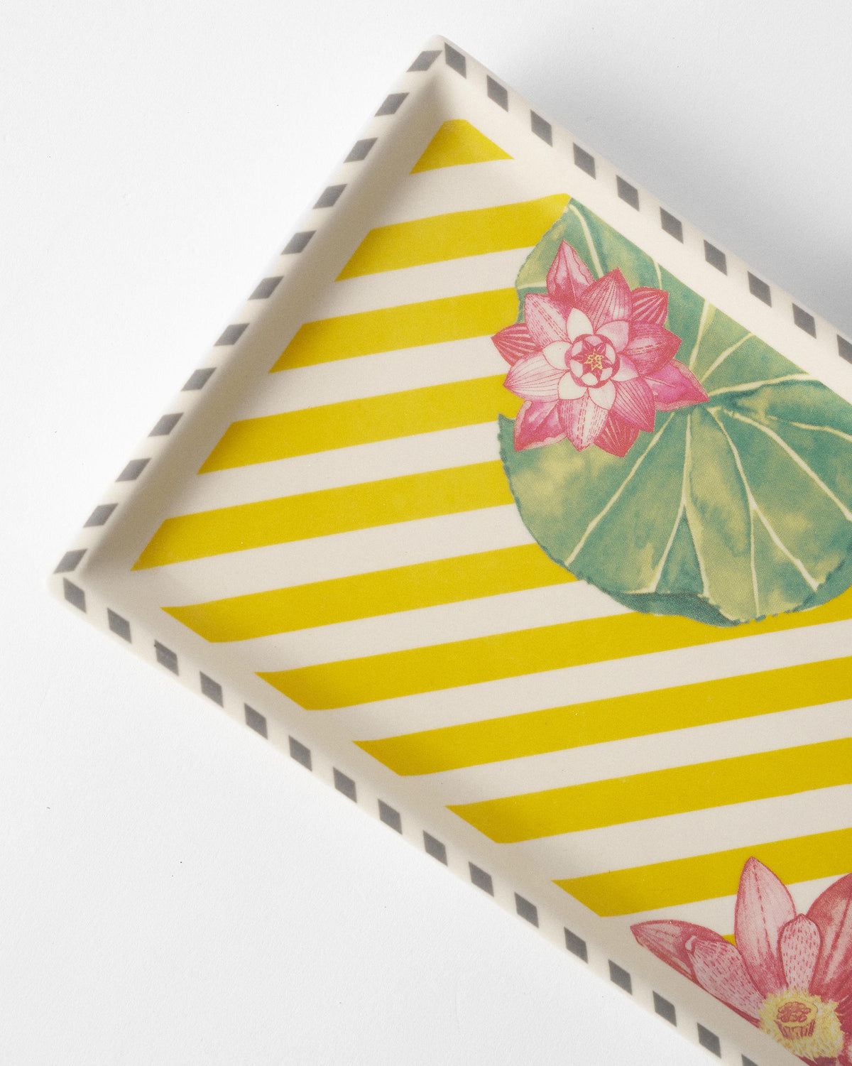 Close-up of yellow Lotus Garden tray showing pink lotus and lily pads.