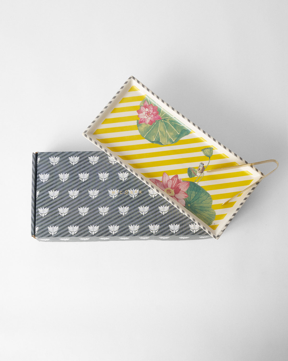Yellow Lotus Garden cookie tray displayed on its Nicobar gift box.