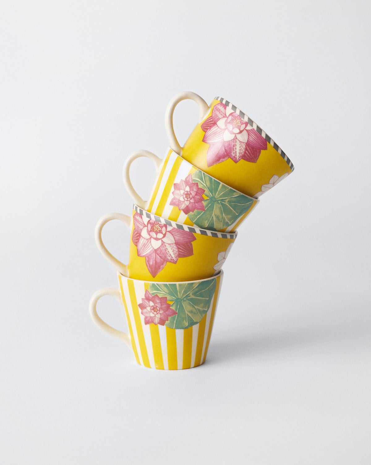 Four Lotus Garden espresso mugs stacked to show the full set.