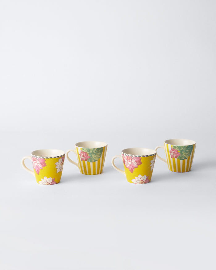 Set of four Lotus Garden espresso mugs in yellow floral and striped prints.