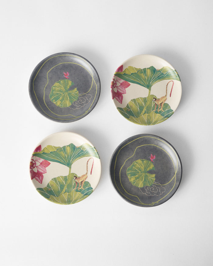 Set of four Float tea plates with lily pad and monkey lotus prints.