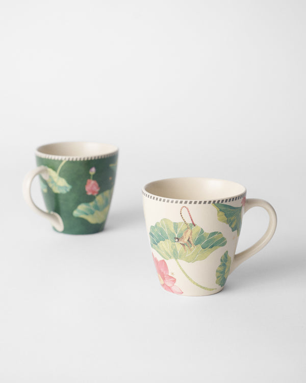 The green and cream mugs side by side