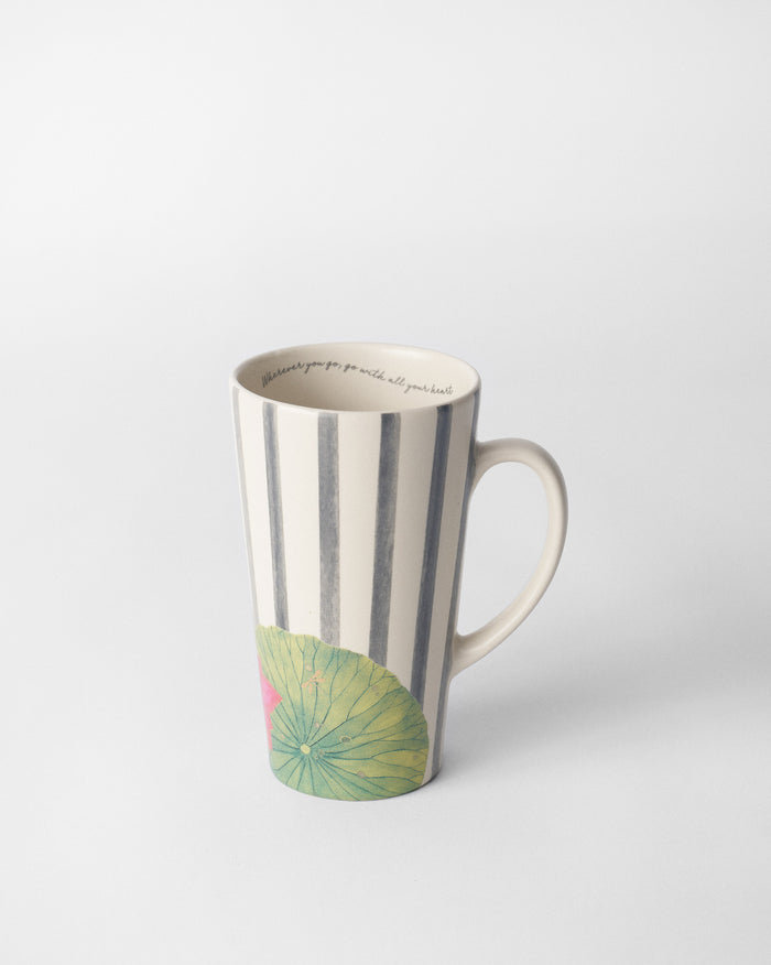 Tall Float mug with charcoal stripes, a green lily pad, and pink lotus near the base.