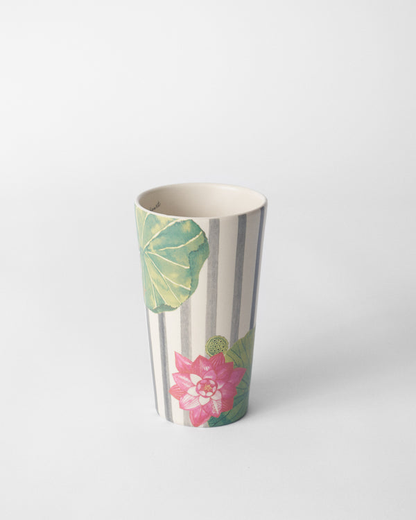 The tall mug standing, lotus at the base