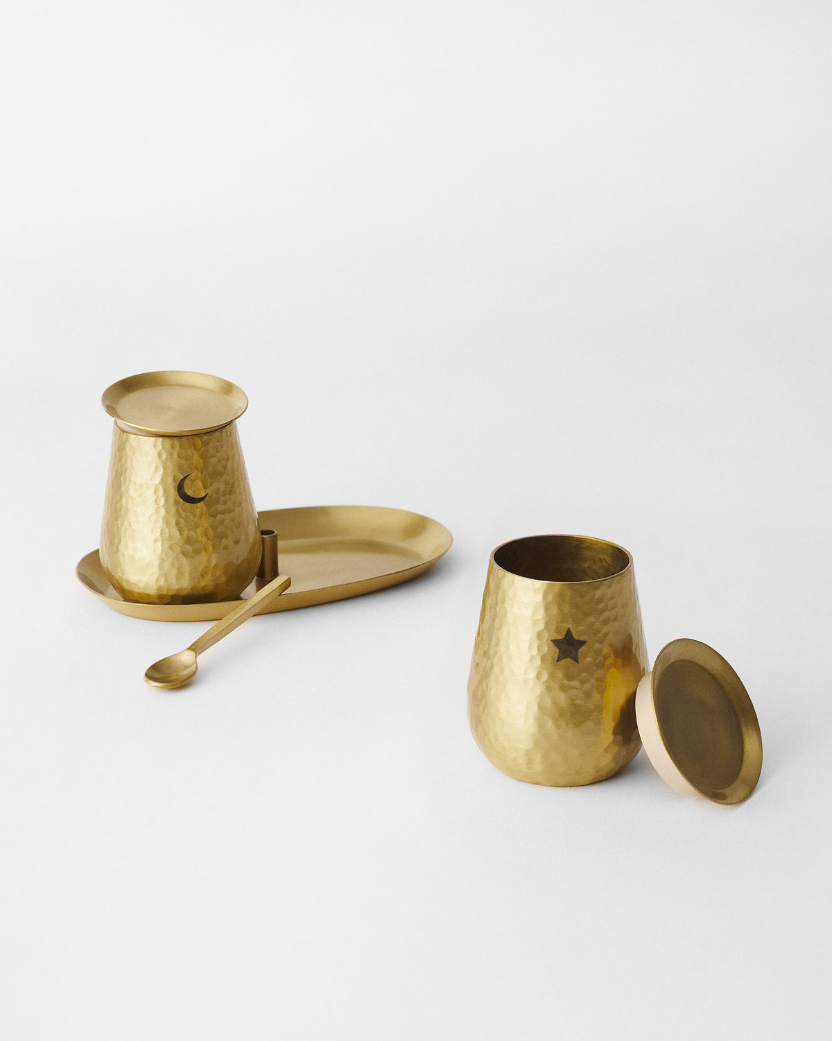 Chand Sitara hammered pots showing moon and star cutouts.