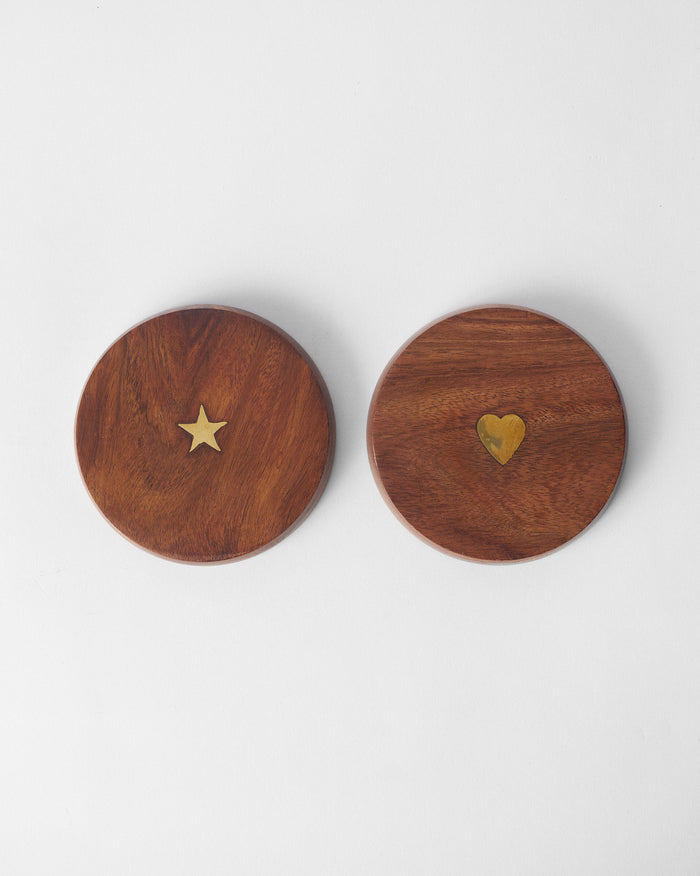 Pair of wooden Aster mug lids with brass star and heart inlays.