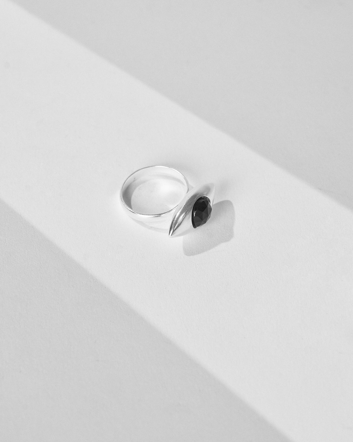 Silver All Seeing Ring showing the eye motif and faceted black stone.