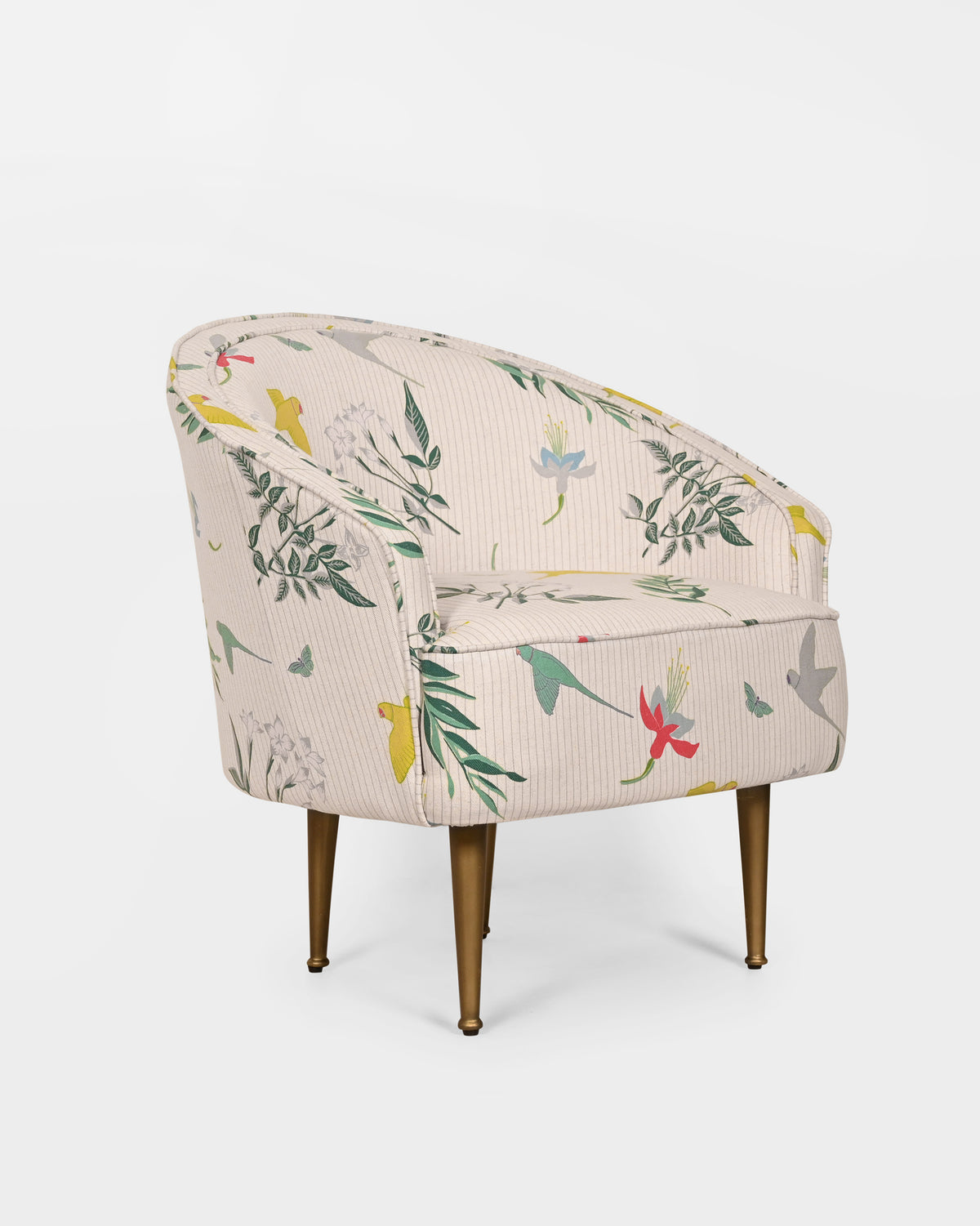 Three-quarter view of Canopy Chair with birds and leaves on cream upholstery.