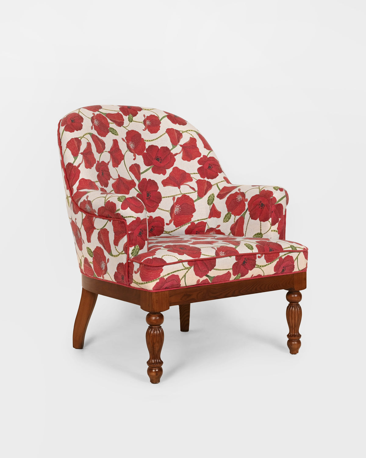 Three-quarter view of the Meadow Chair in red poppy upholstery.