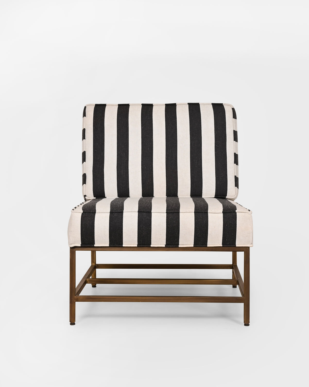 Isle Chair with black and cream striped upholstery on a brass-toned frame.