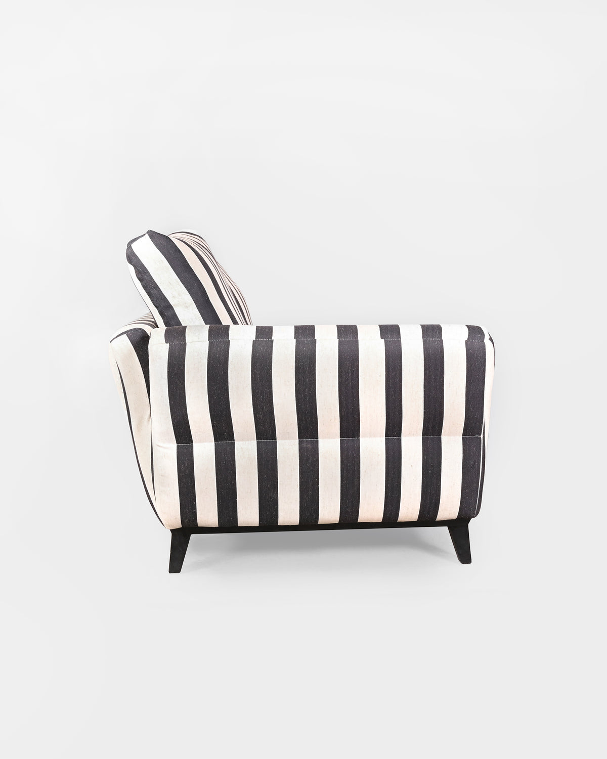 Side profile of the charcoal striped Ele Grove sofa with tapered black legs.