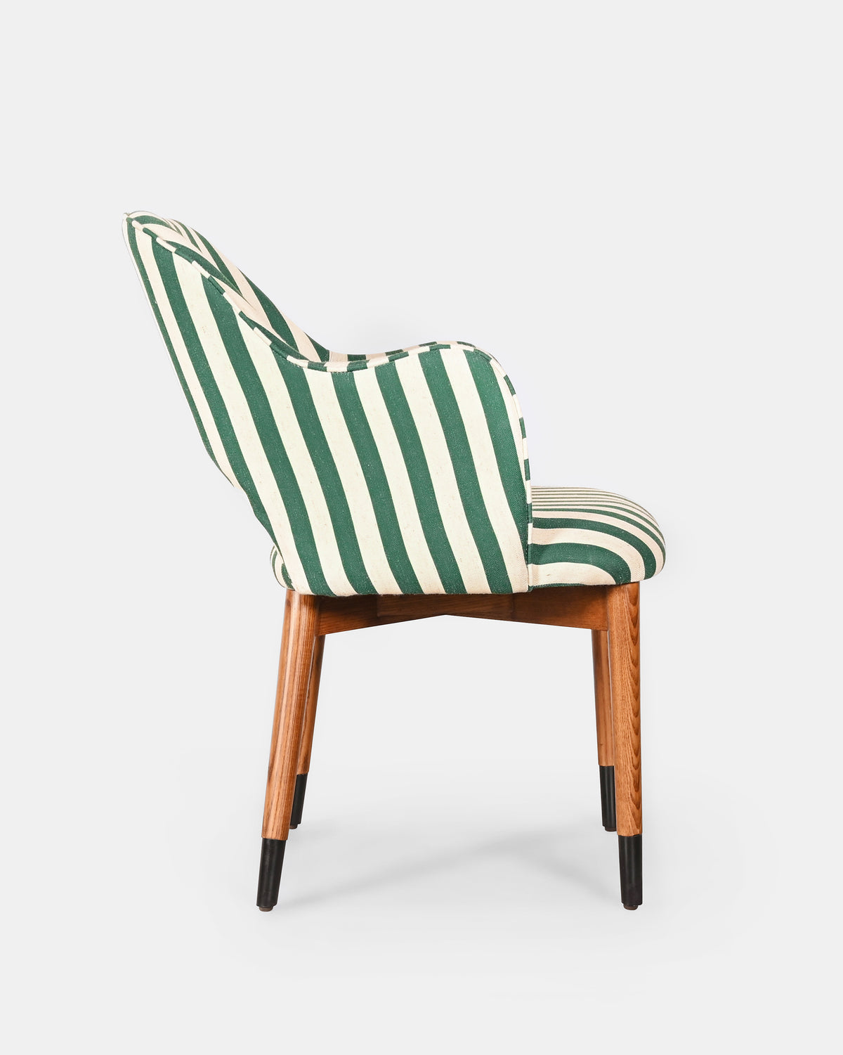 Side view of the Rhythm dining chair with black-tipped wooden legs.