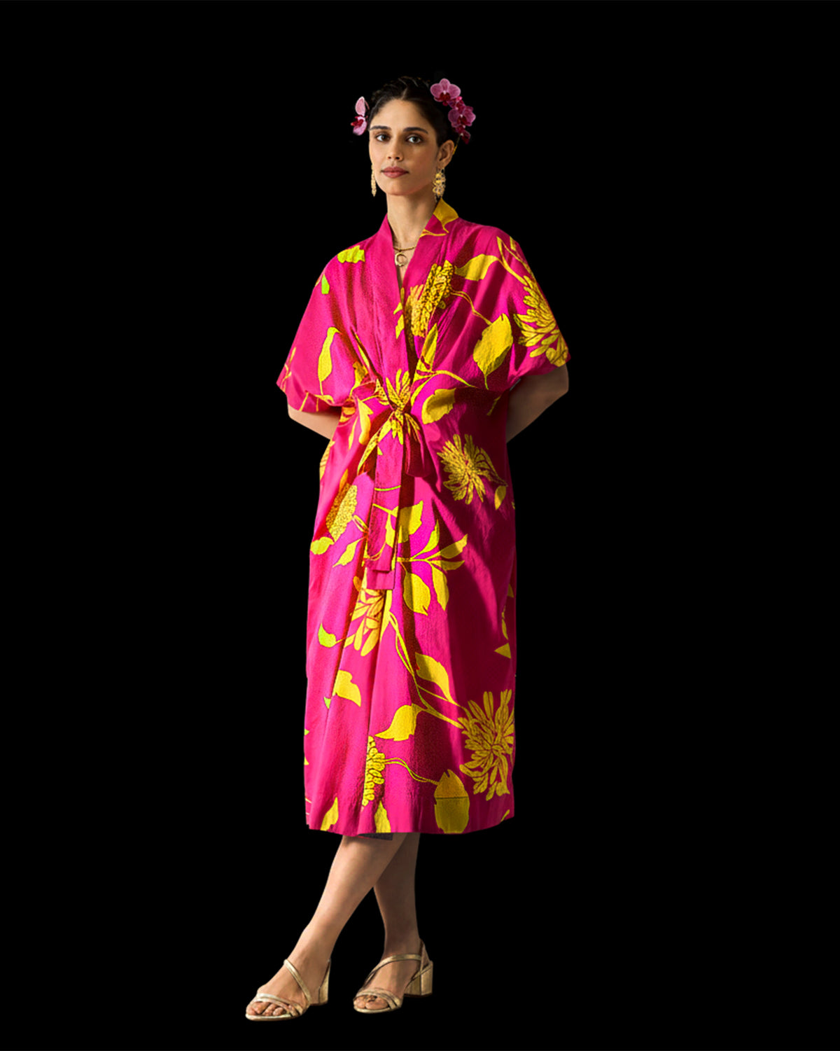 Fuchsia Doda dress with lime floral print tied at the waist.