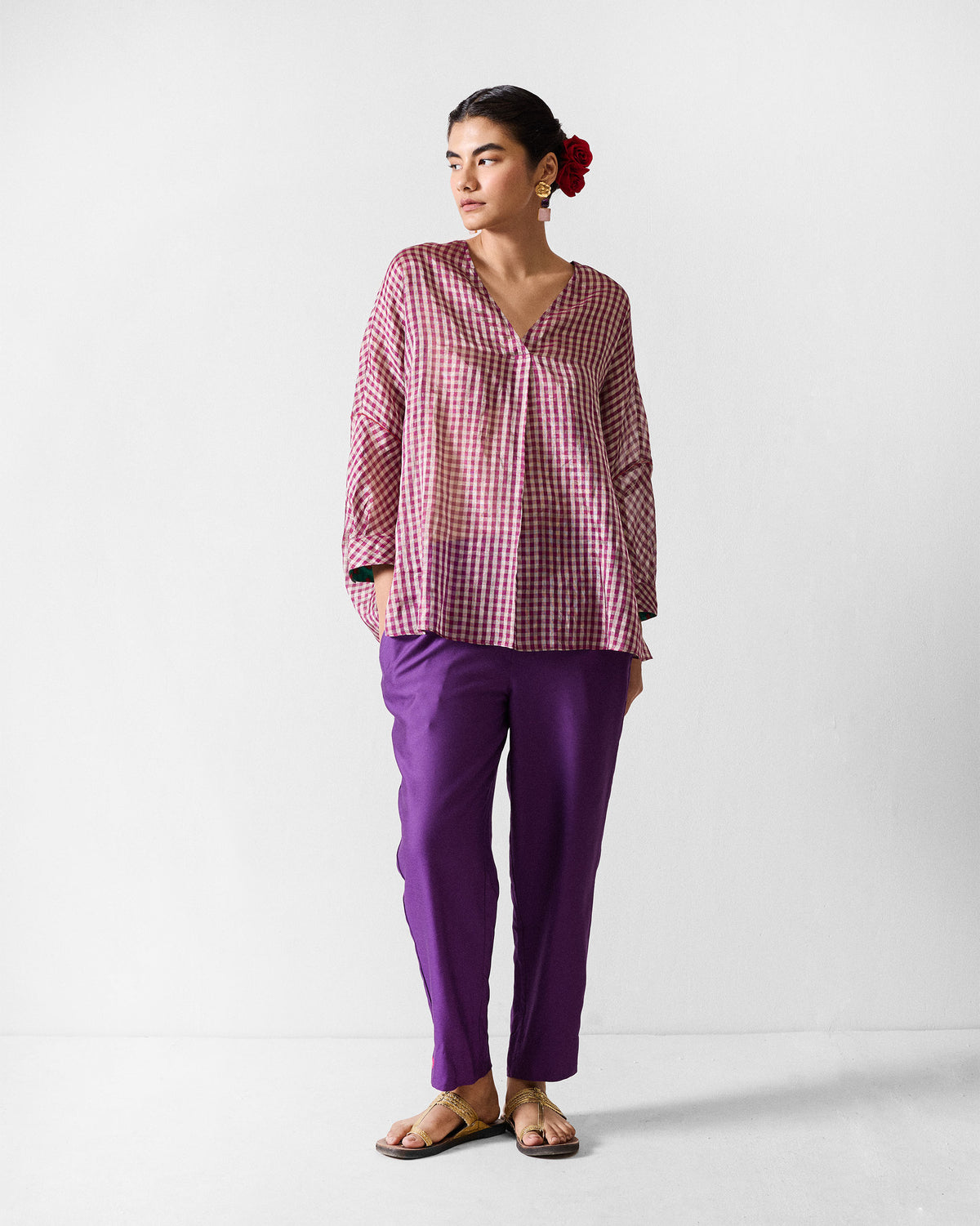 Person wearing purple Darjeeling pants with a straight cropped silhouette.