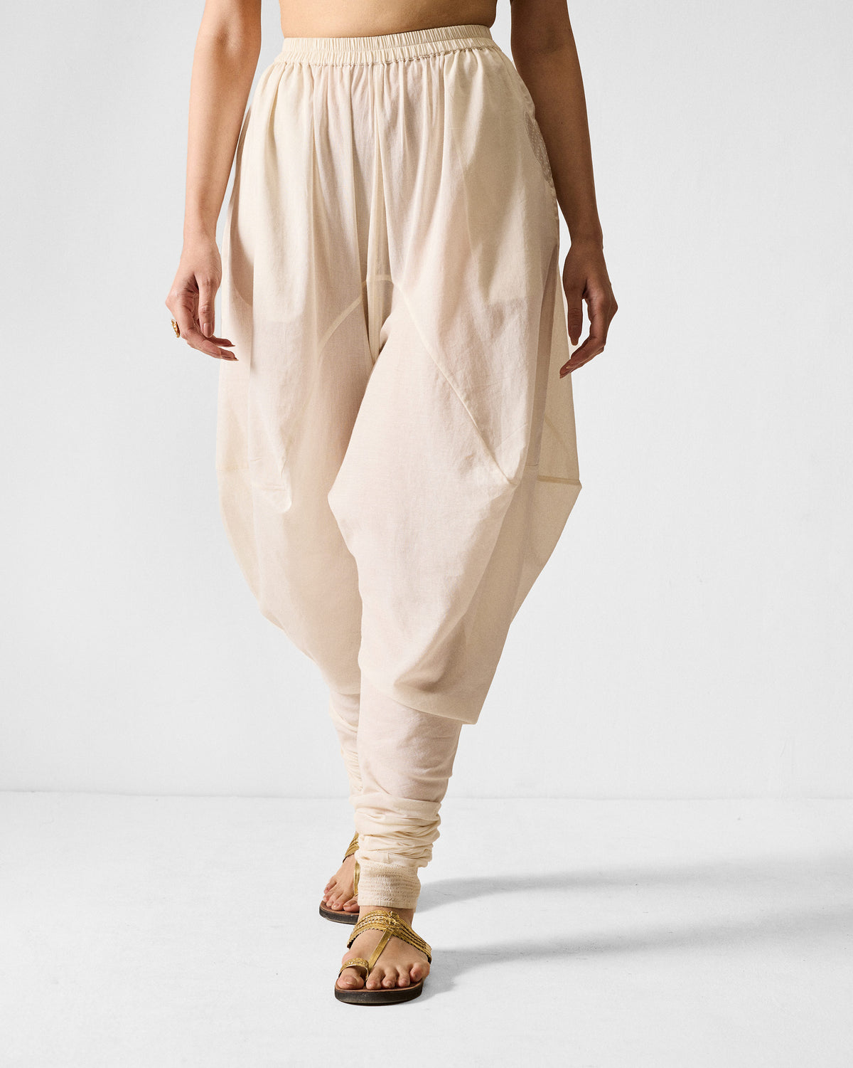 Ivory Jaisalmer Pants with a draped dhoti fit and gathered ankles.
