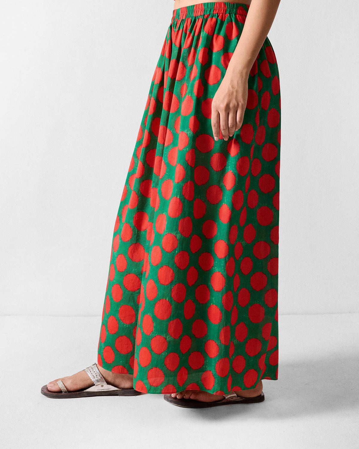 Side view of Yoi Hem Pants showing the wide flared leg.