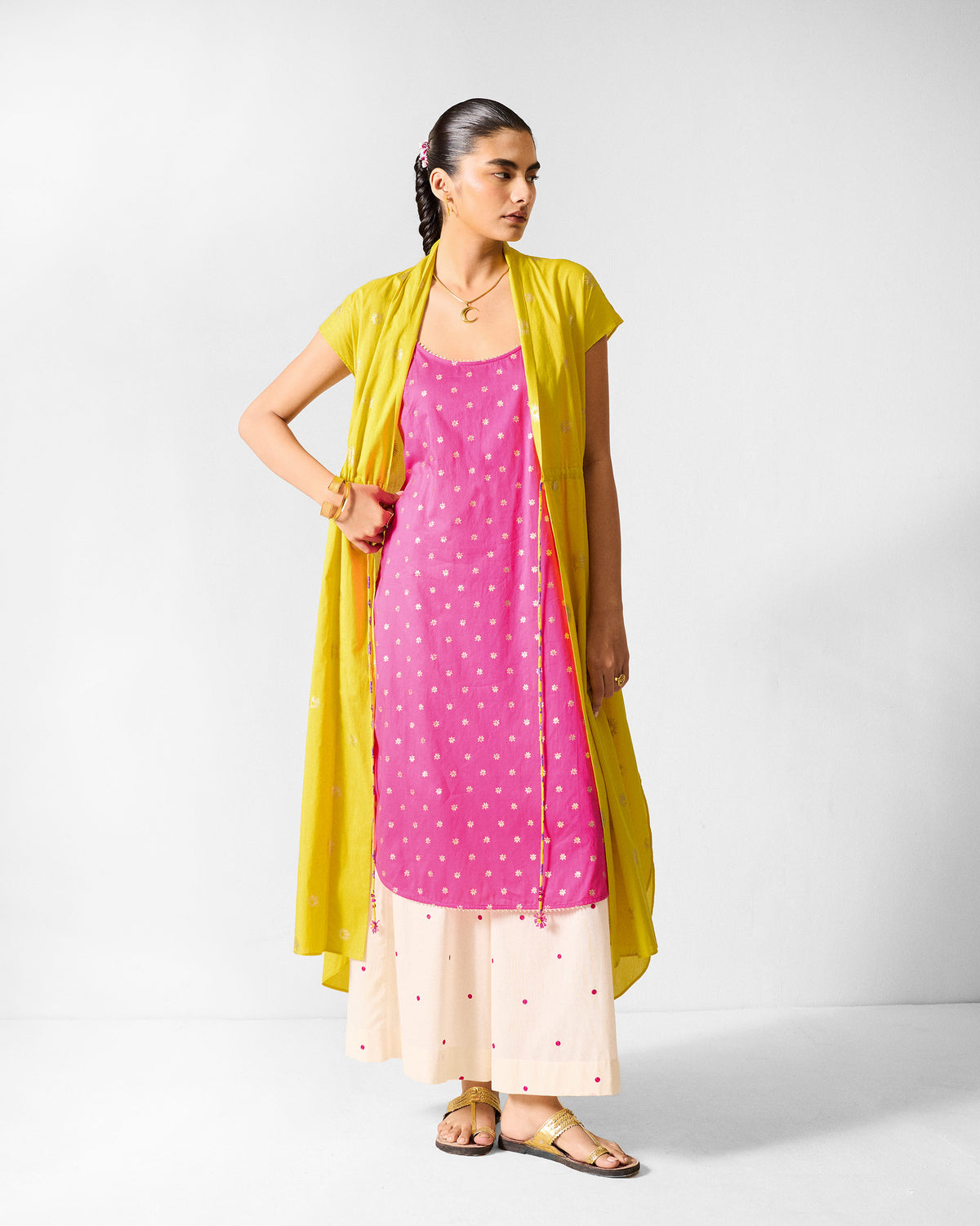 Person wearing a fuchsia Vintage Camisole layered under a yellow outer layer.