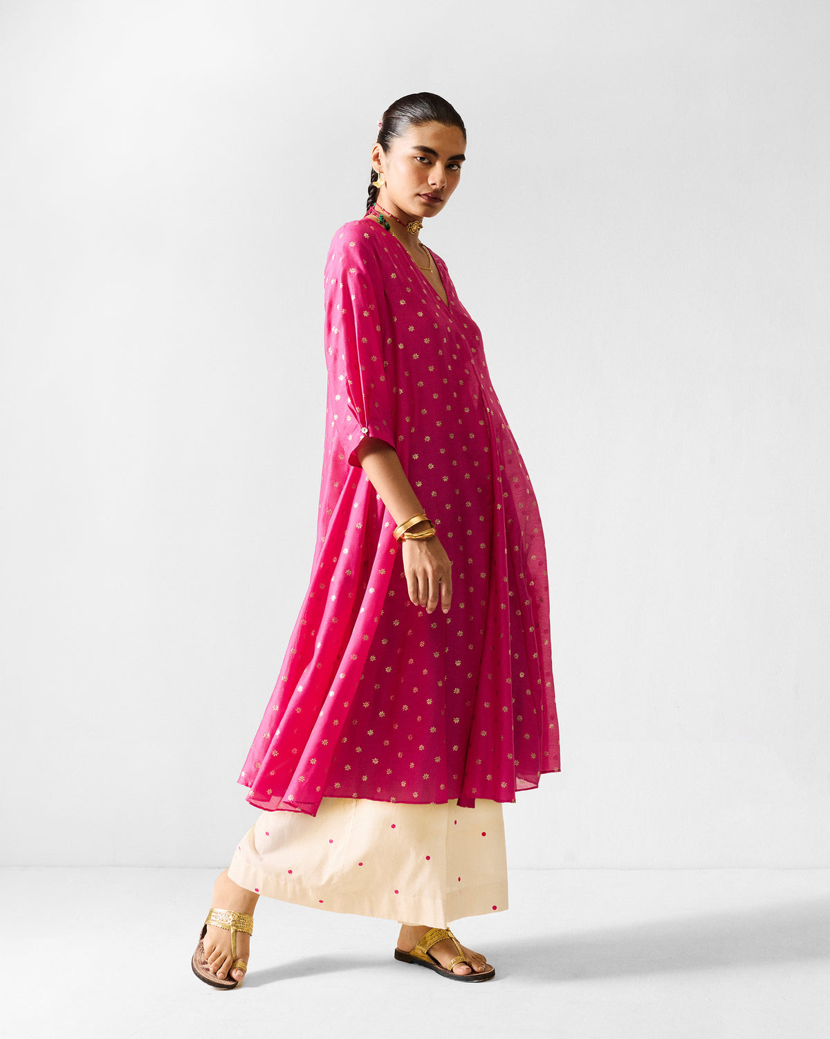 Fuchsia Kannauj Kurta with tiny gold floral prints and a flared hem.