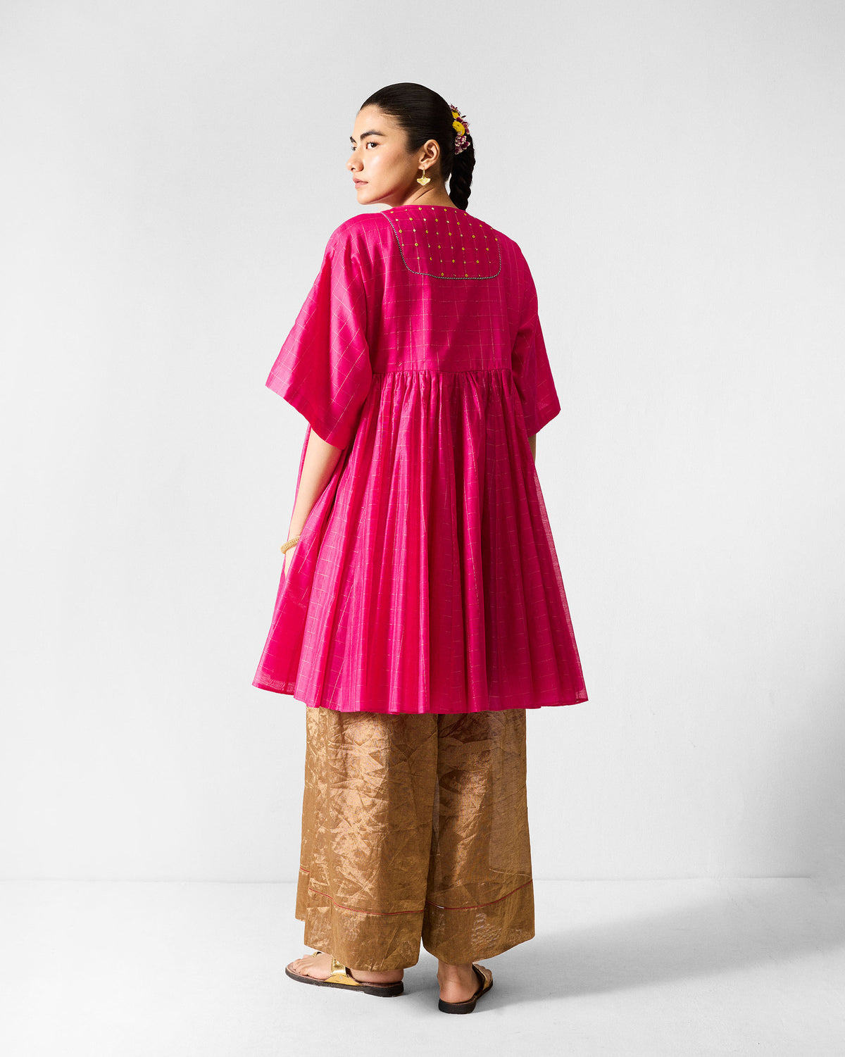 Back of a fuchsia Luna Afghan Kurta with a yellow embroidered yoke.