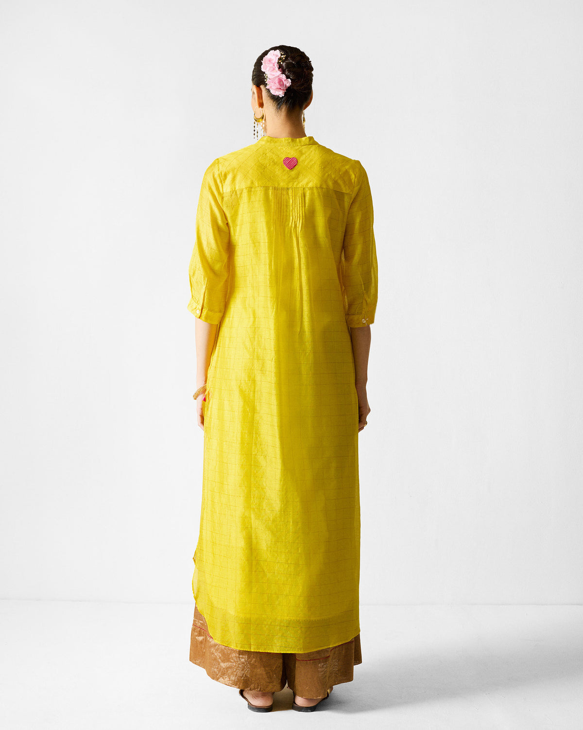 Back of a lime and gold checked Kumaon Kurta with a pink embroidered heart.