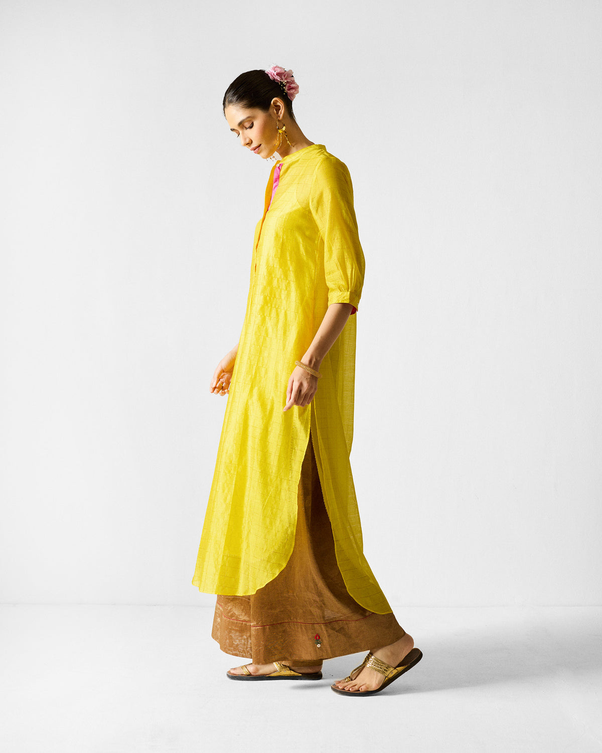 Side view of a lime and gold checked Kumaon Kurta with a deep side slit.