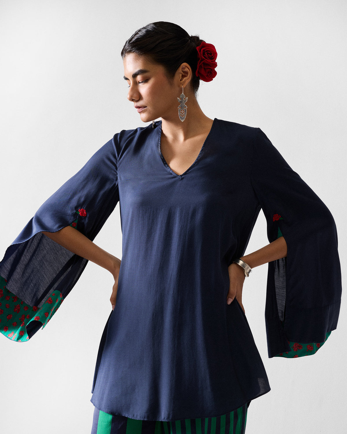 Person wearing a dark navy Panaji Top with flared split sleeves.