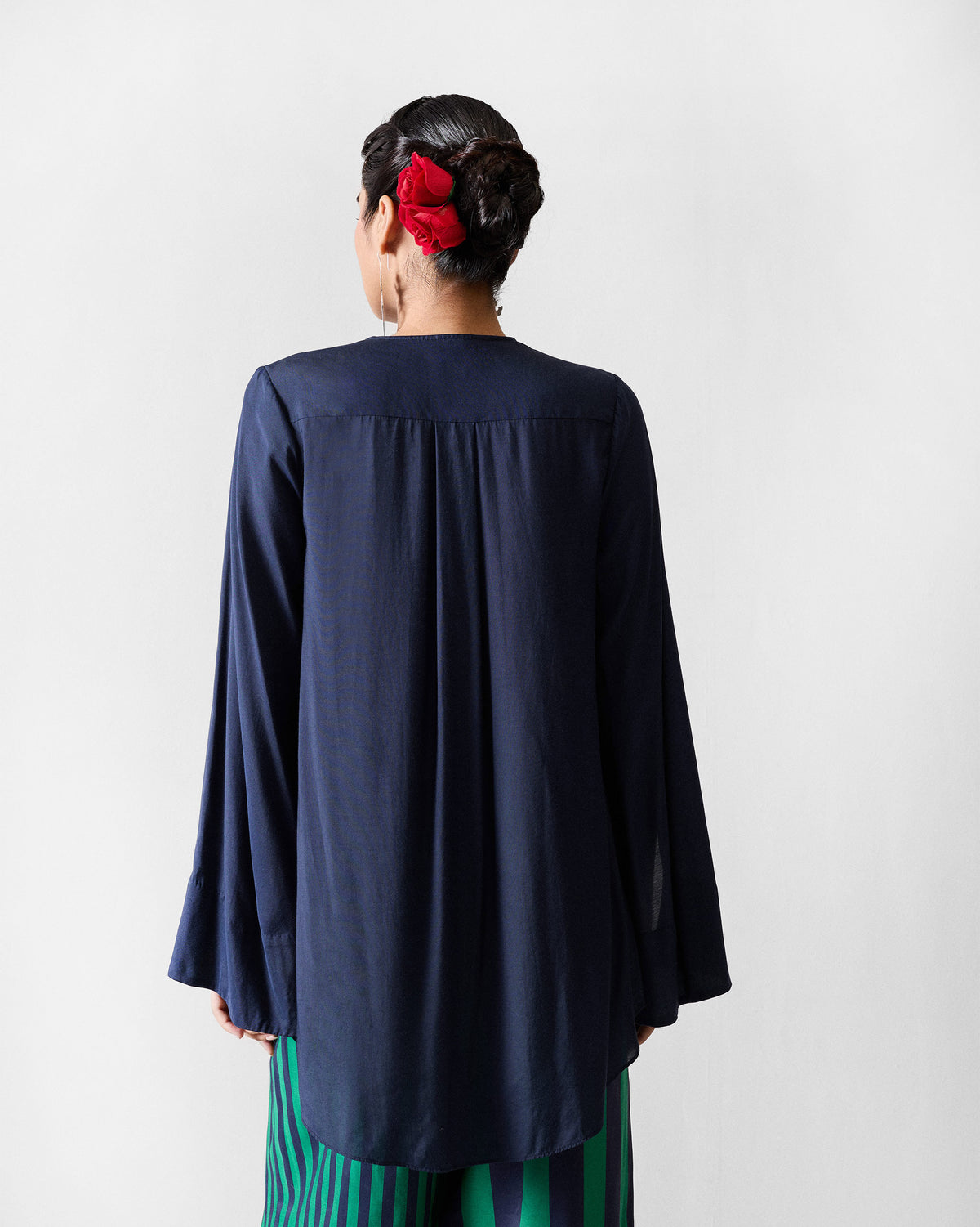 Back of a dark navy Panaji Top with a gathered yoke.