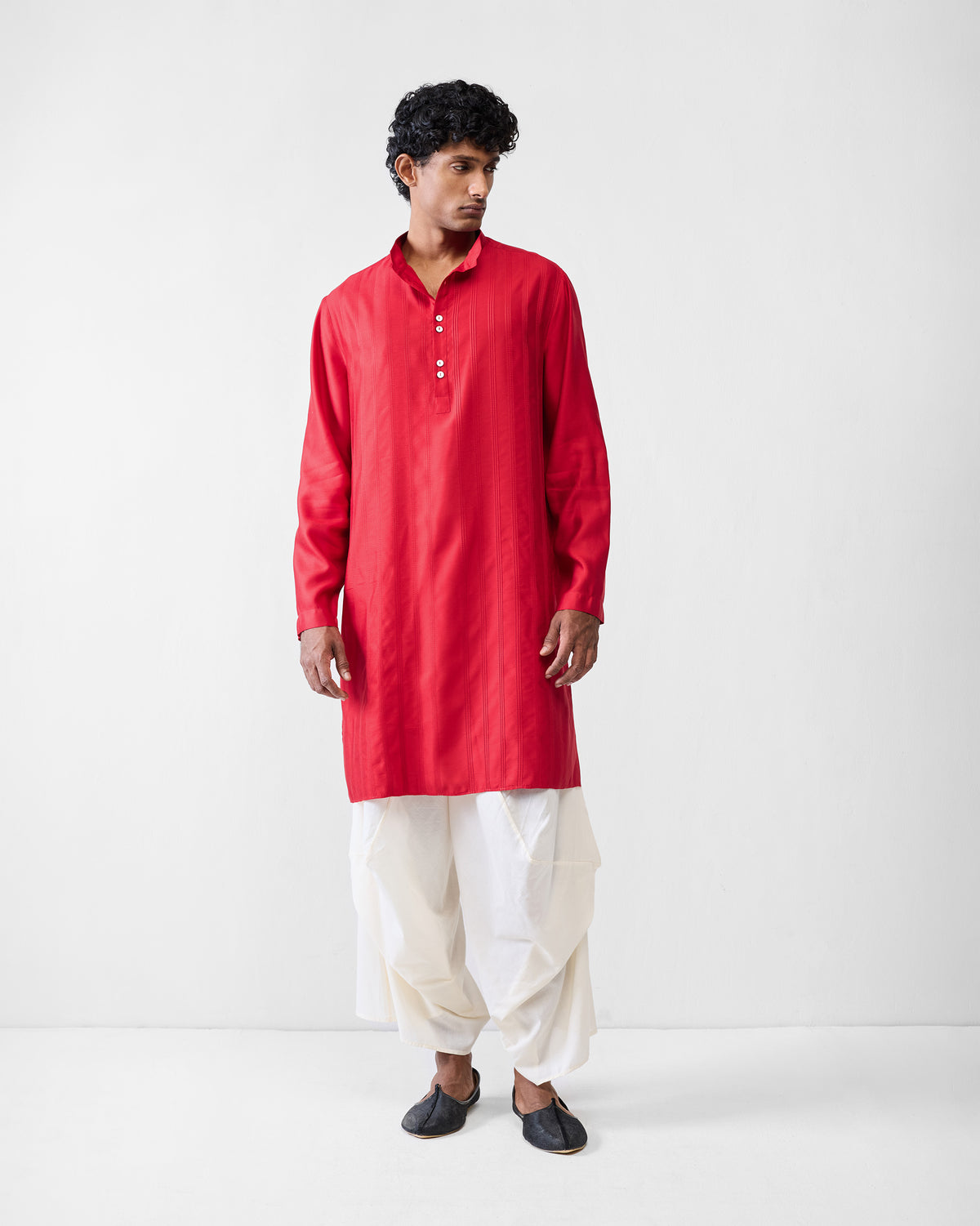 Person wearing a bright red Long Pleated Kurta with a mandarin collar.