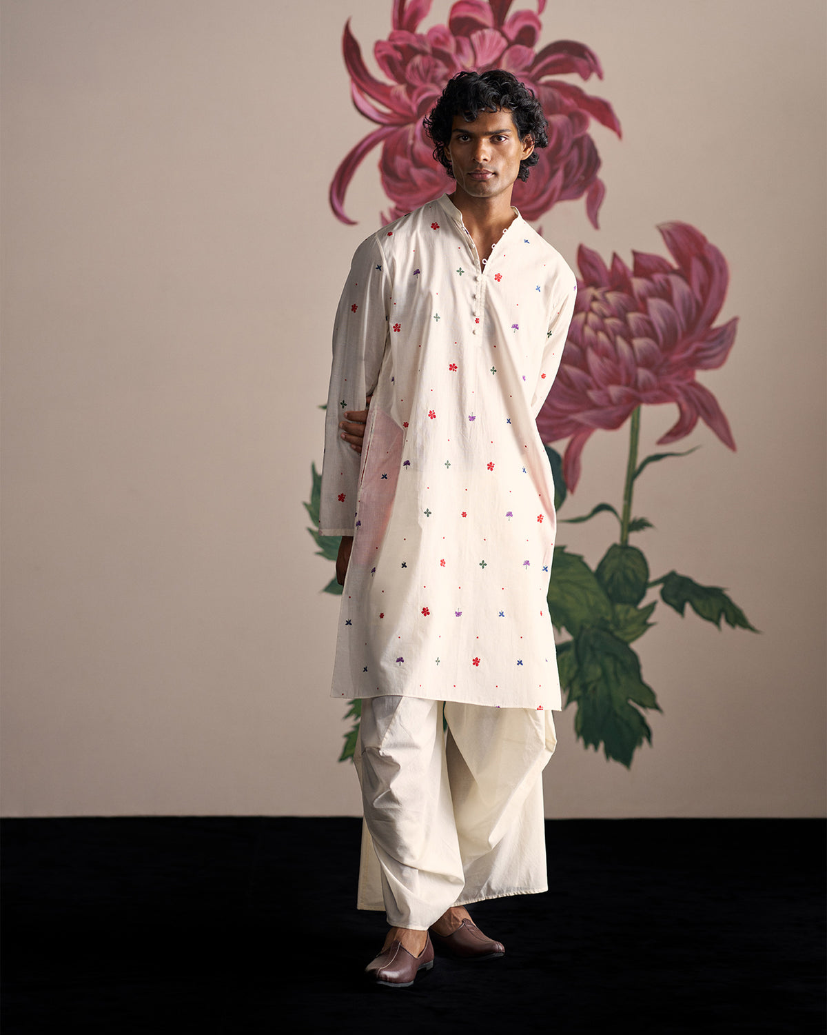 Ivory Zenith Kurta with red embroidered motifs worn full length.