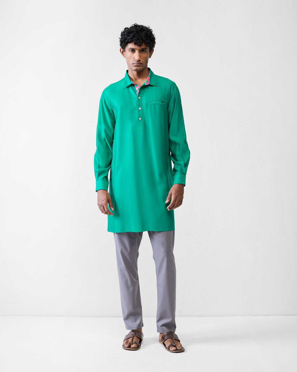 Person wearing an emerald green Bouquet kurta.