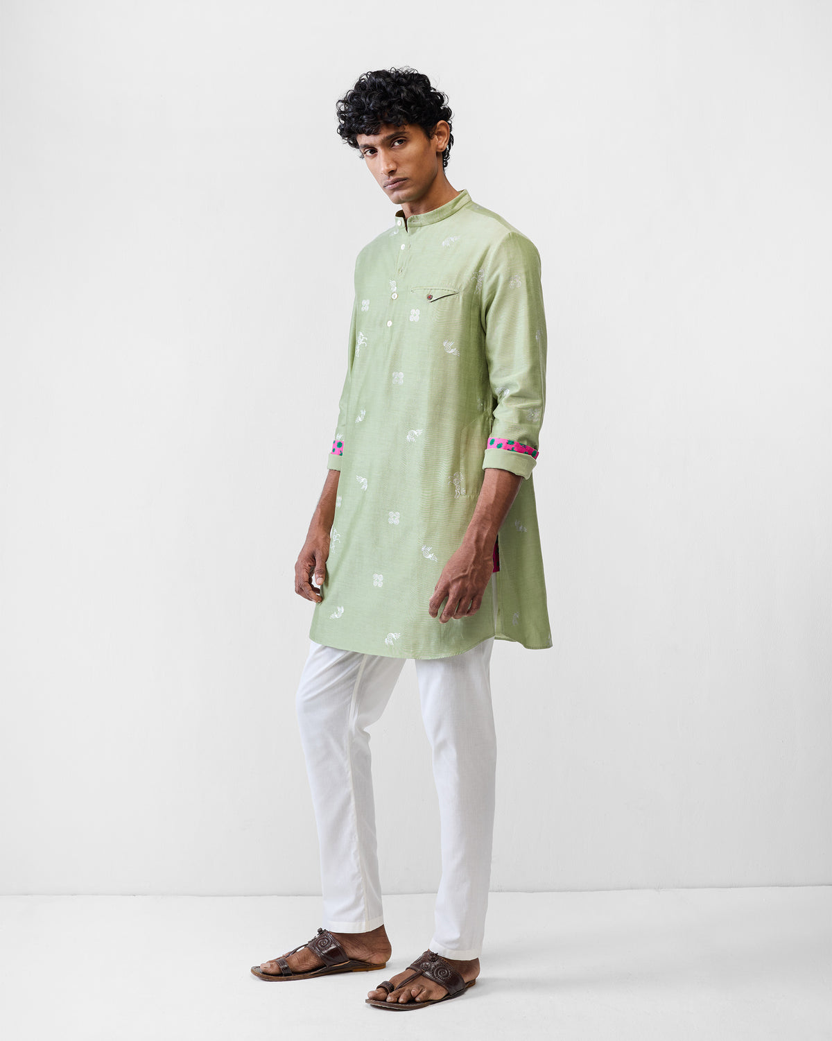 Person wearing a mint Fort kurta with a mandarin collar and chest pocket.