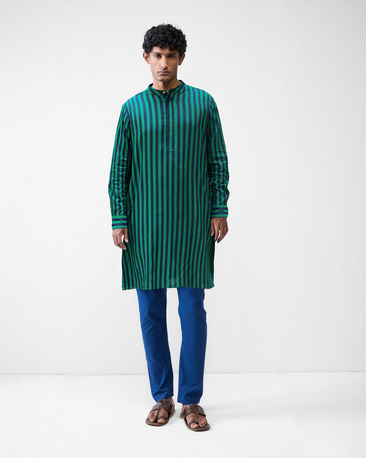 Person wearing a green and navy striped Gala Kurta with a band collar.
