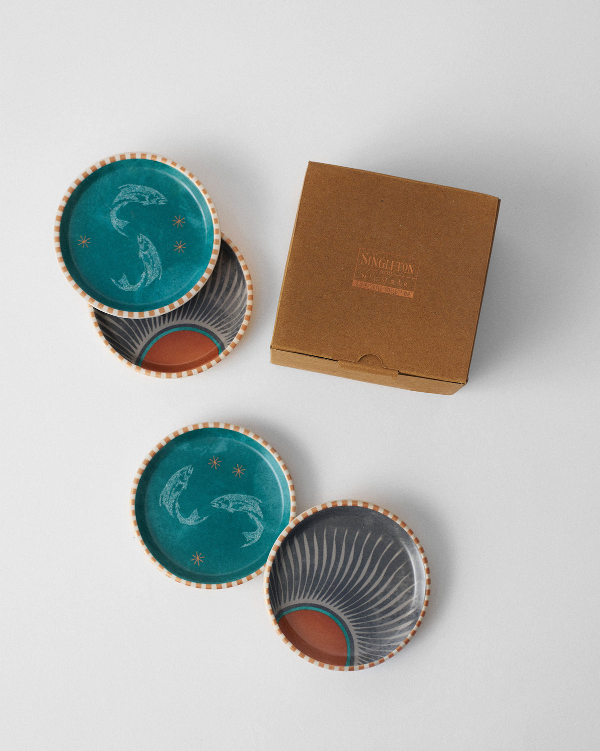 Aluna coaster set of four beside a Singleton x Nicobar gift box.