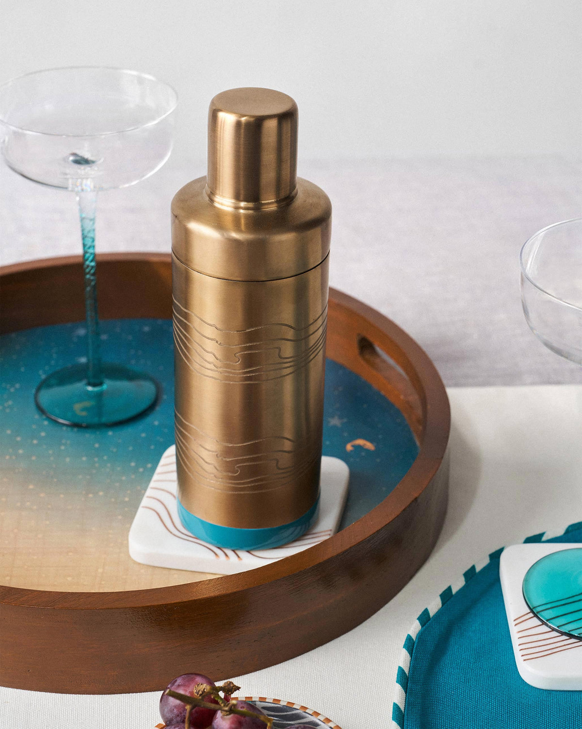The Caden shaker on a teal tray.