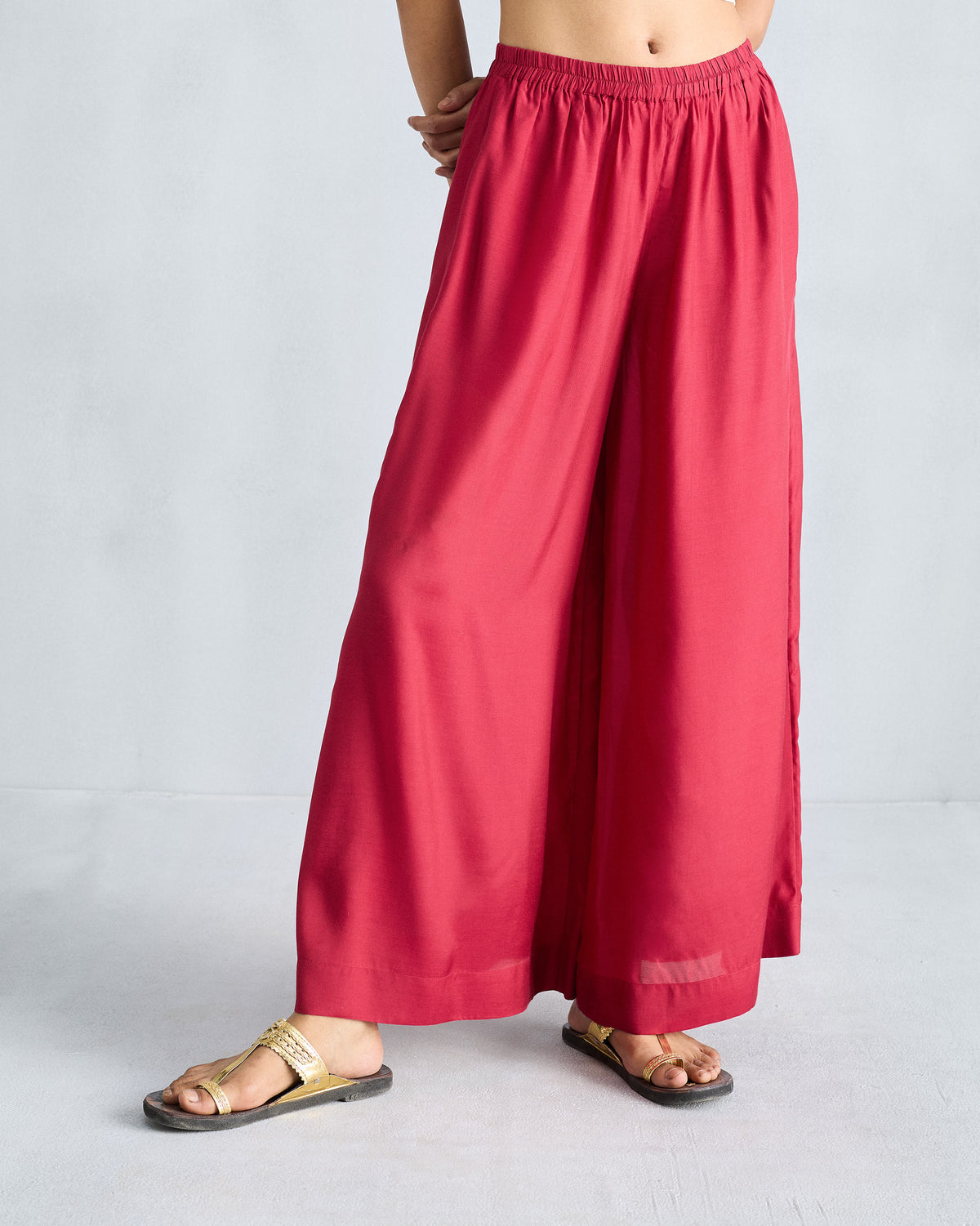 Person wearing red Classic Pyjama pants showing a voluminous wide-leg drape.