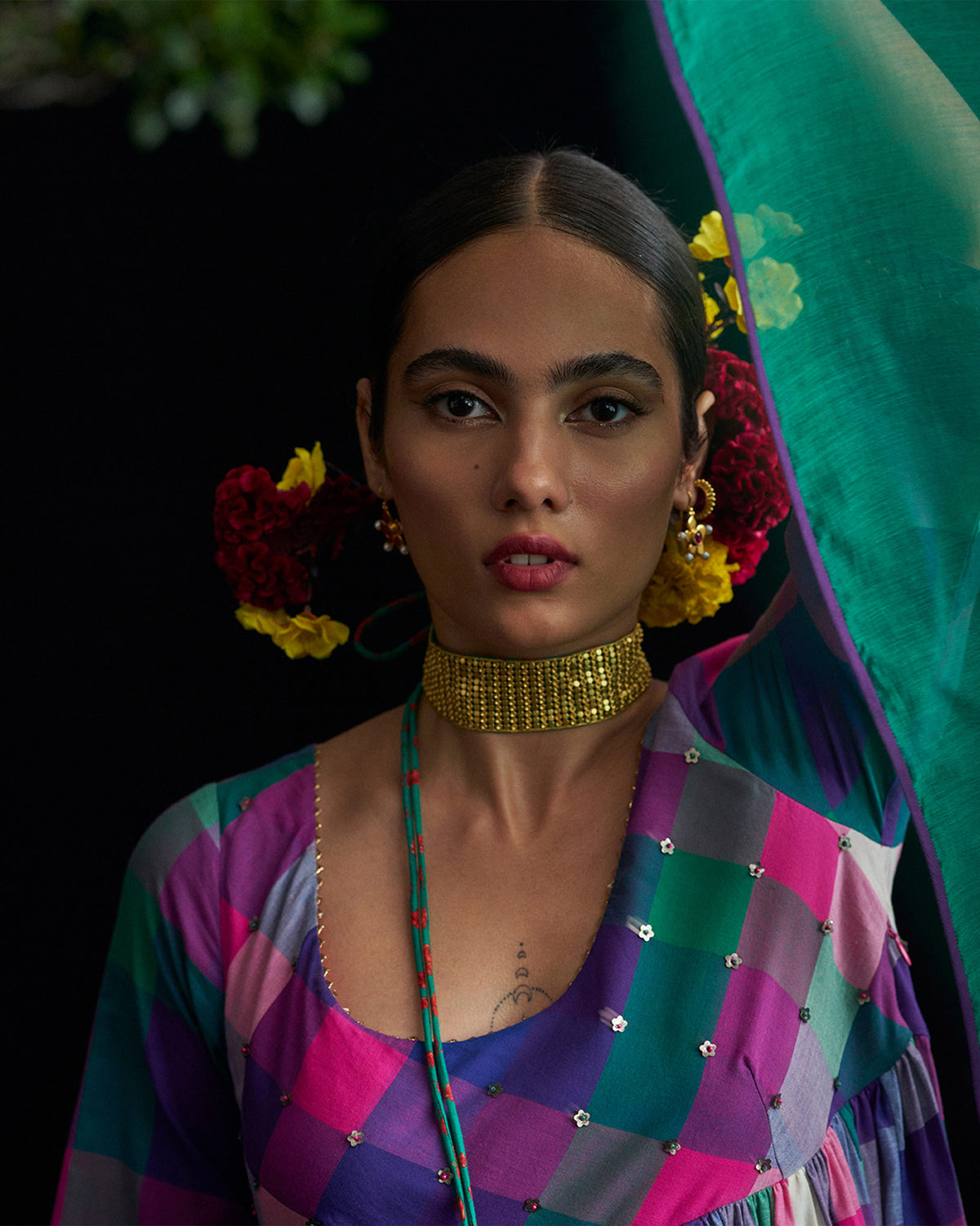 Gold Chain Mail choker worn with a colourful checkered top.