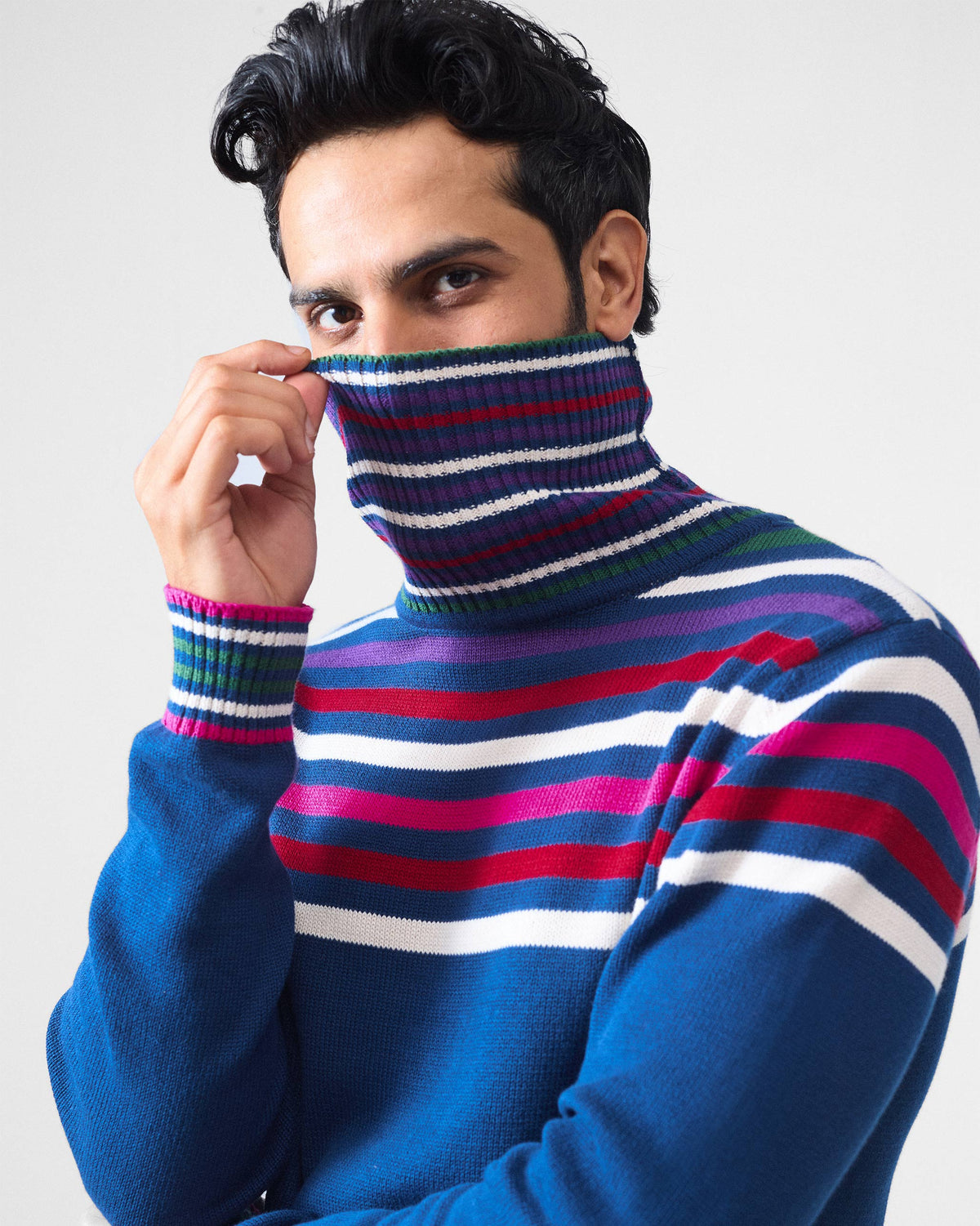 Close-up of the striped turtleneck collar on a navy Ringer sweater.