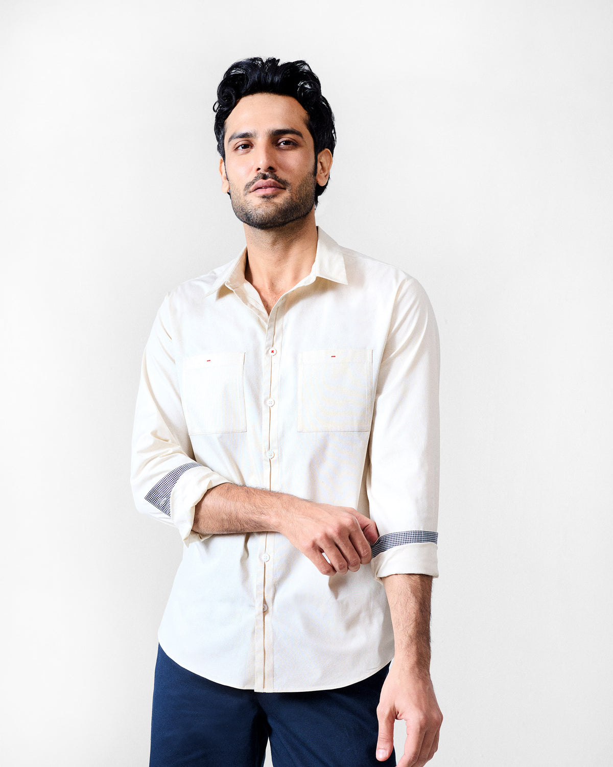 Ivory Abe shirt with rolled sleeves and contrast cuff lining.