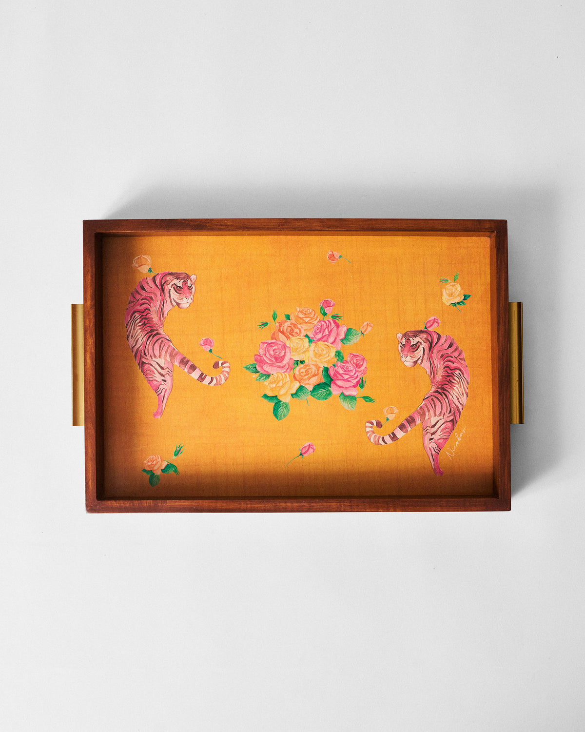 Overhead view of the Myra tray showing pink tigers and roses on a mustard yellow base.