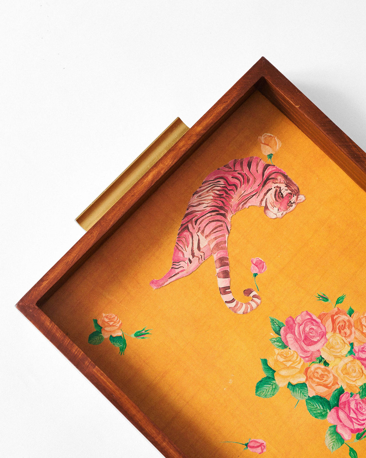Close-up of pink tiger and rose print on the mustard yellow Myra tray base.