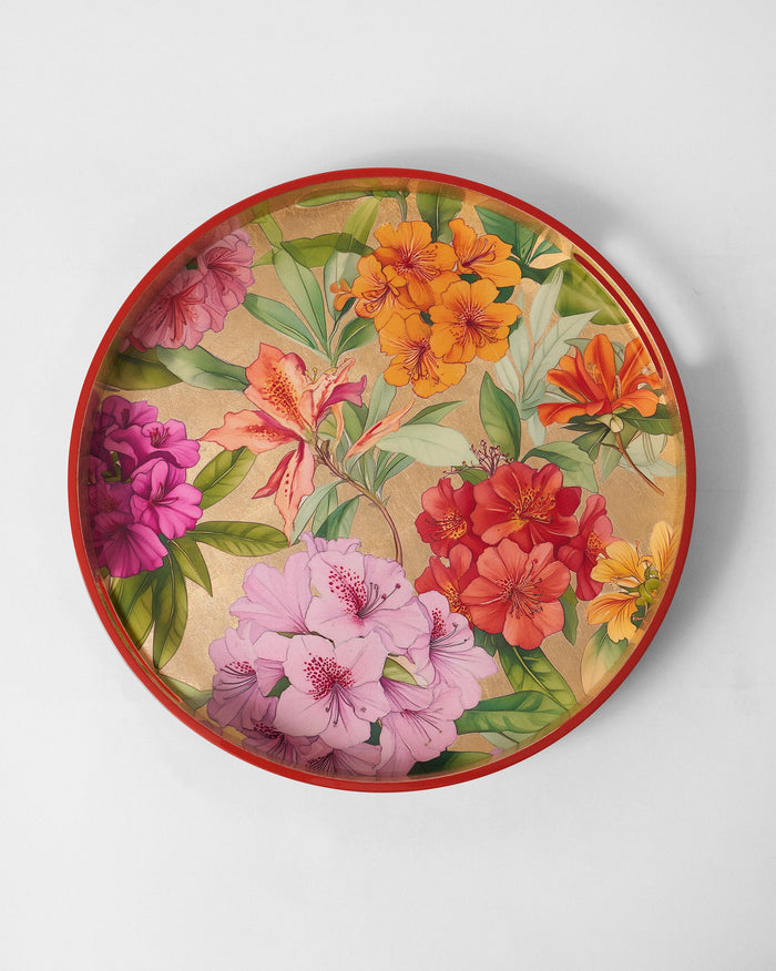Round tray with a red rim and multicolour blooms on a gold interior.