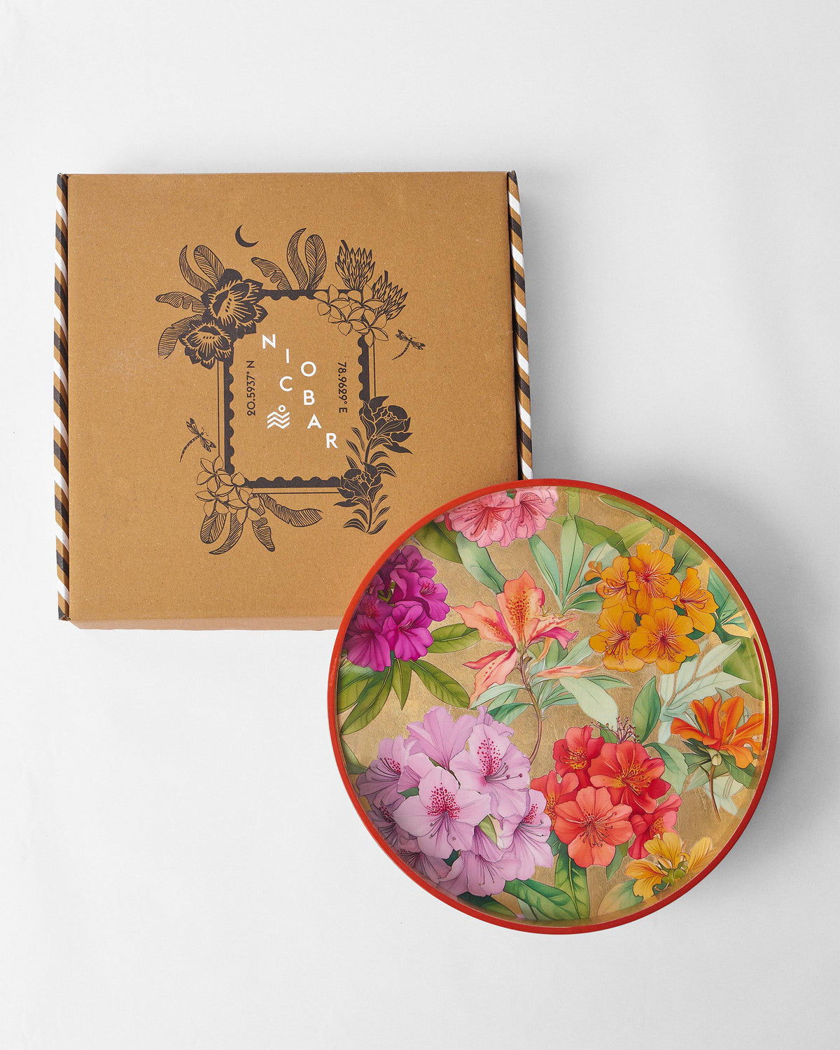 Blooming Flower round tray shown with its Nicobar gift box.