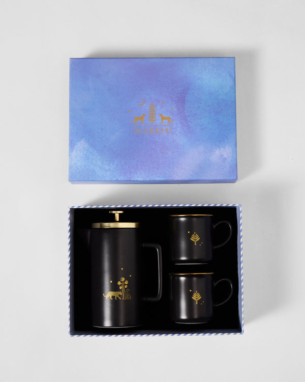 The open box, press and two mugs in their places