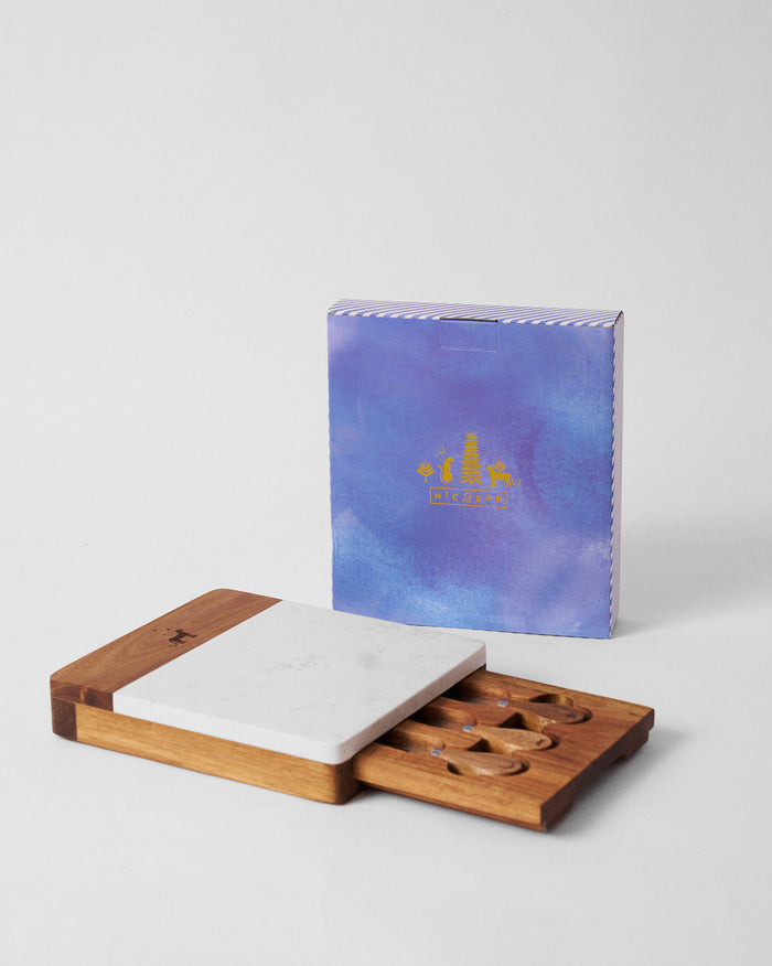 Sindhuraa cheese board with a white top and a slide-out tray.