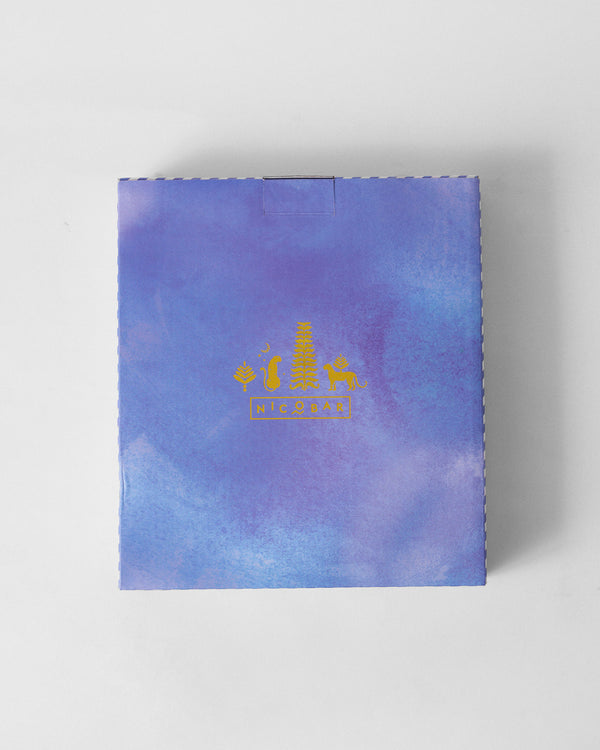 The lavender gift box with a gold crest