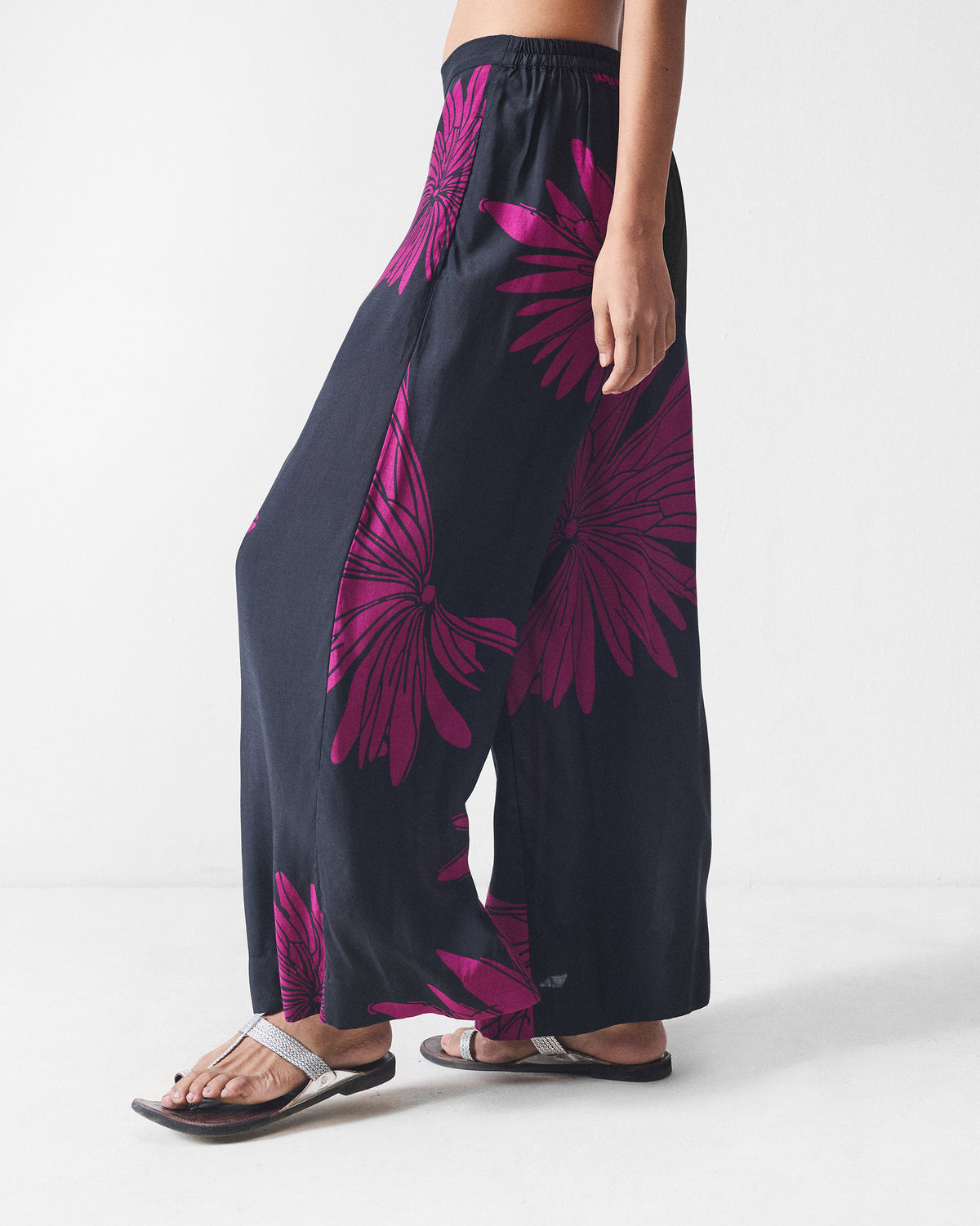 Side view of black and mulberry printed Basic pyjamas with a floral print.