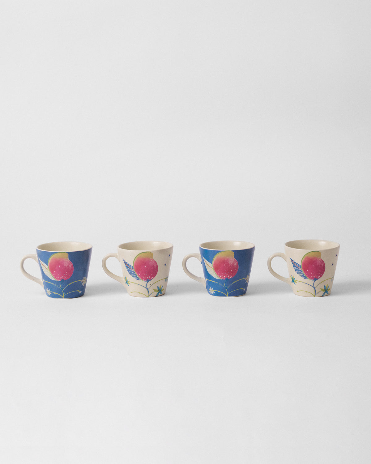 Set of four Ambi Espresso Mugs alternating blue and cream mango designs.