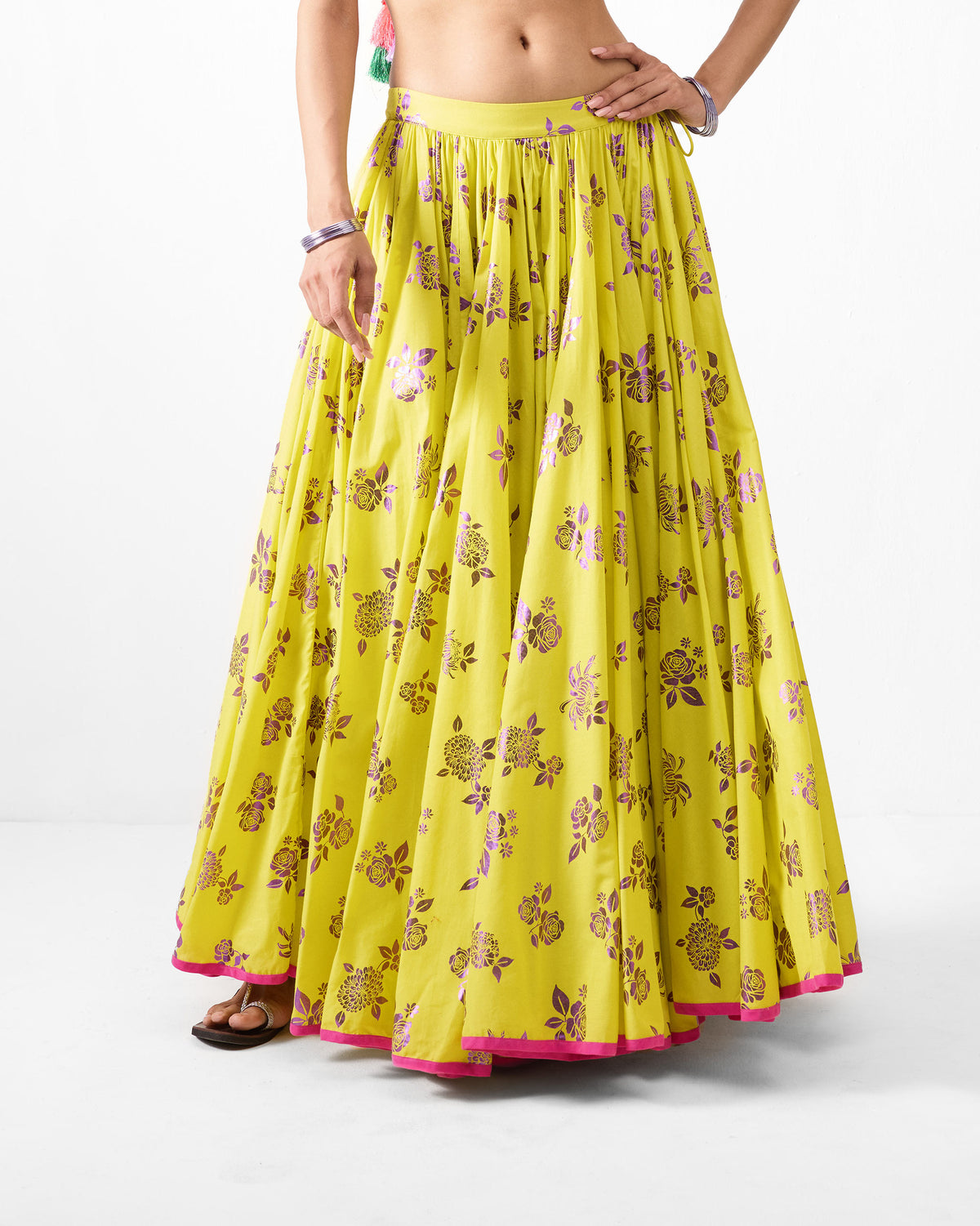 Lime Noor skirt with purple foil florals and a pink hem border.